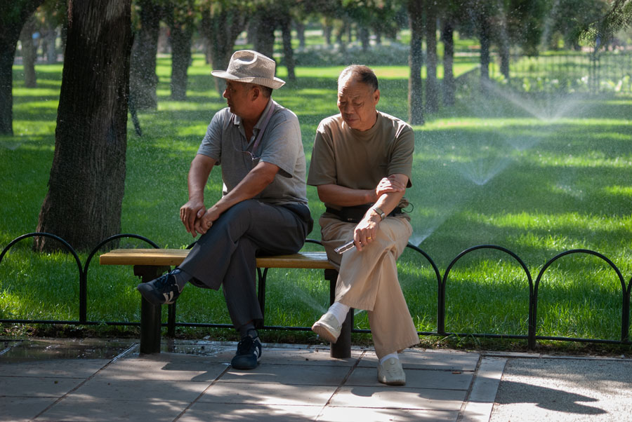 Two men in the Temple of Heaven park, Beijing