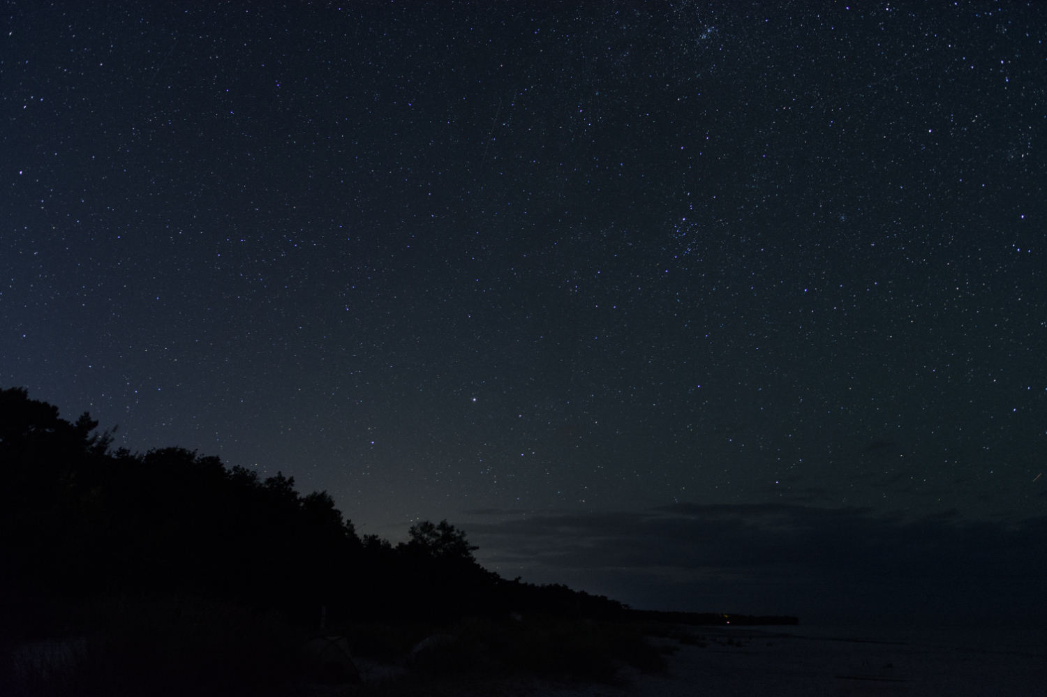Stars and Milky Way over the beach of Bornholm