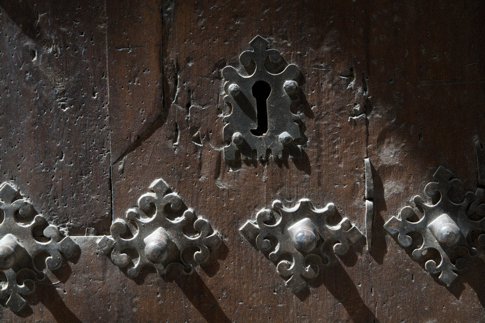 Old Spanish door of an abandoned house near Casterlenas